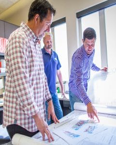 industry-ingenious-products men working on blueprint